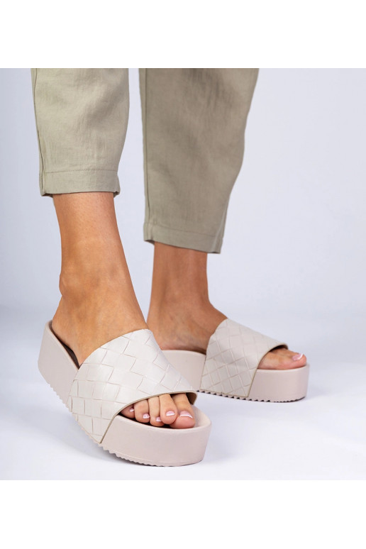 Zandkleurige damespantoffels met... Zandkleurige damespantoffels met...