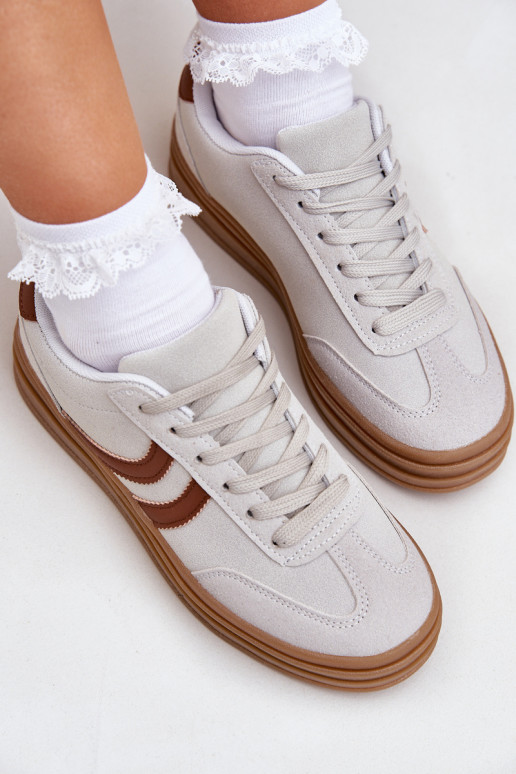 Grijze stijlvolle dames sneakers met... Grijze stijlvolle dames sneakers met...
