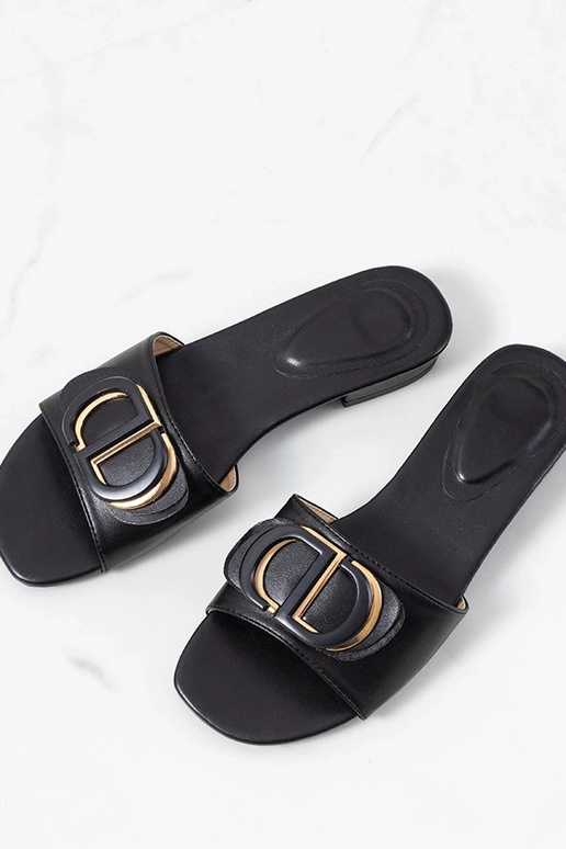 Zwarte slippers op een platte hak,...