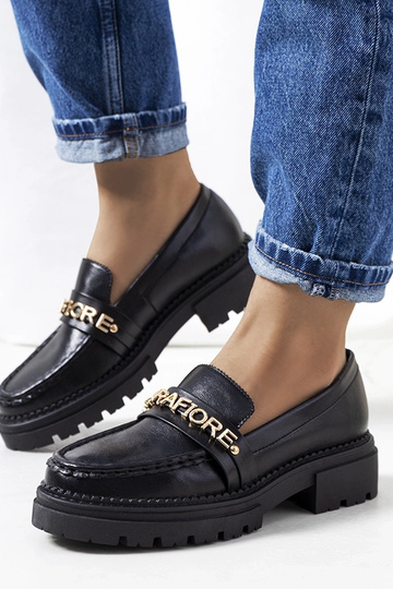 Zwarte mocassins op hoge...