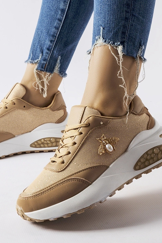 Brune og hvide sneakers med dekorativ...