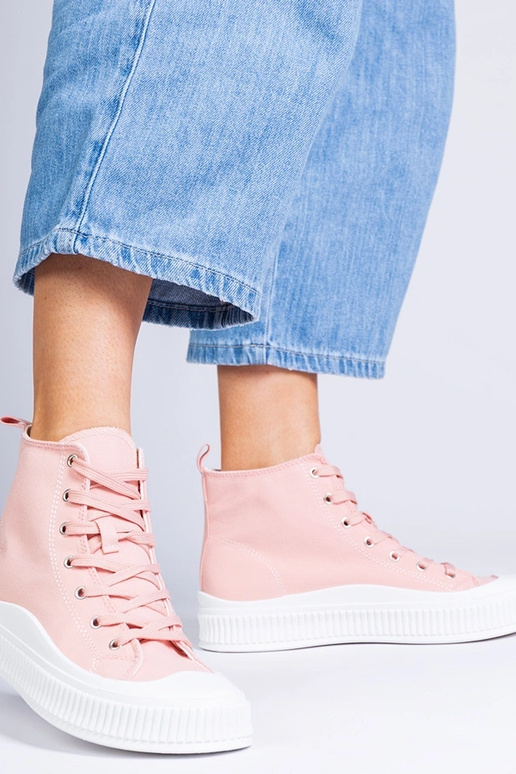 Roze hoge schoenen op een platform,...