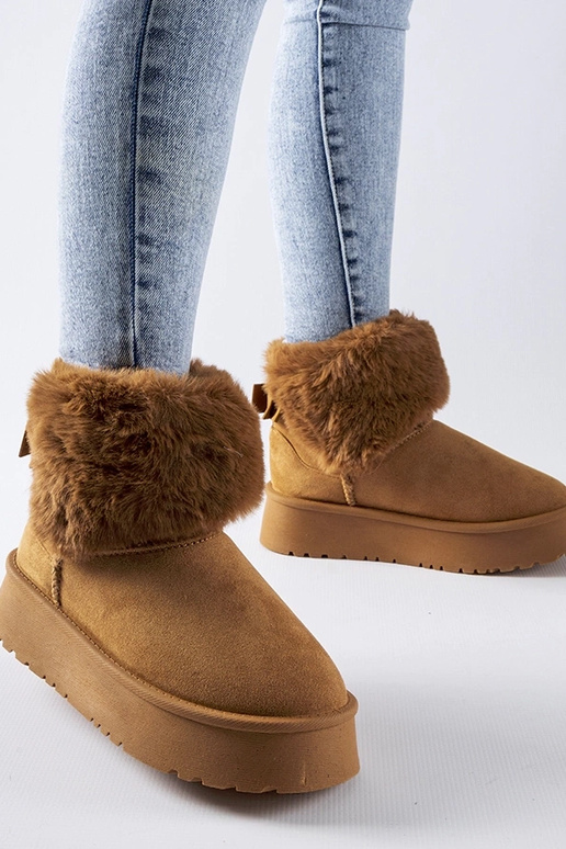 Bronskleurige sneeuwlaarzen versierd...