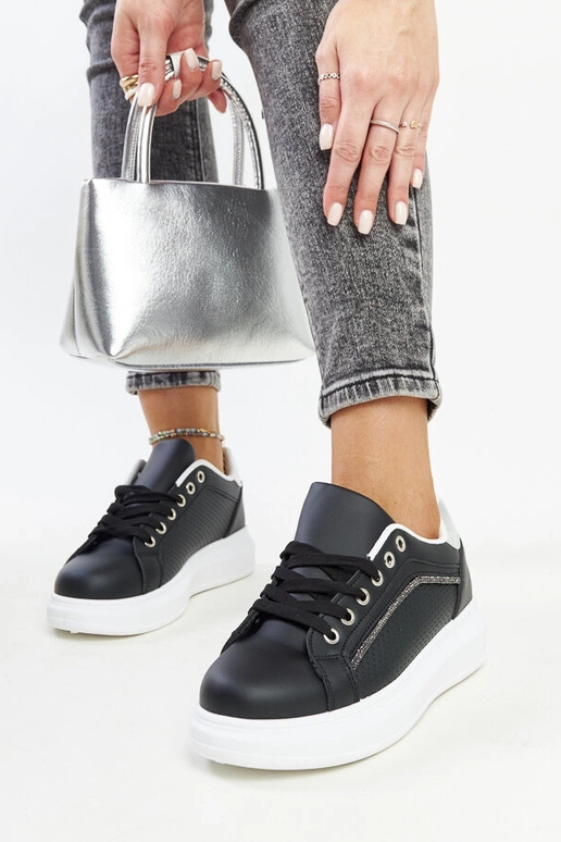 Sorte sneakers med dekorative...