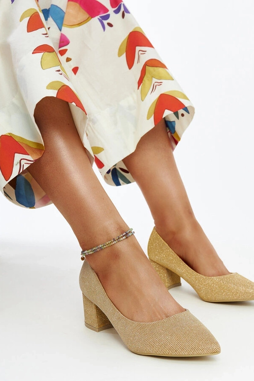 Gouden glanzende instappers met...