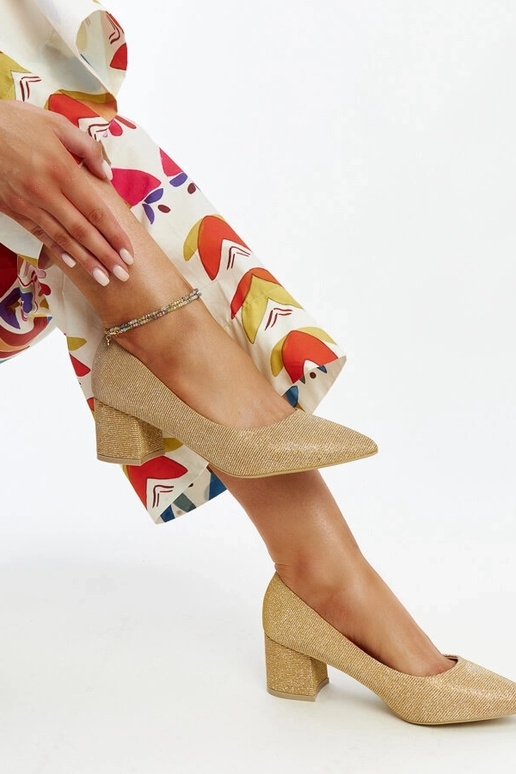 Gouden glanzende instappers met...