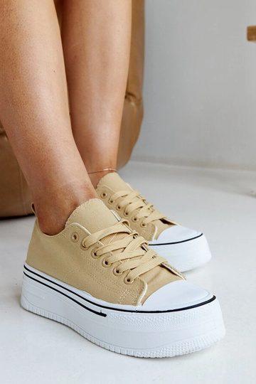 Mørke beige sneakers med en...