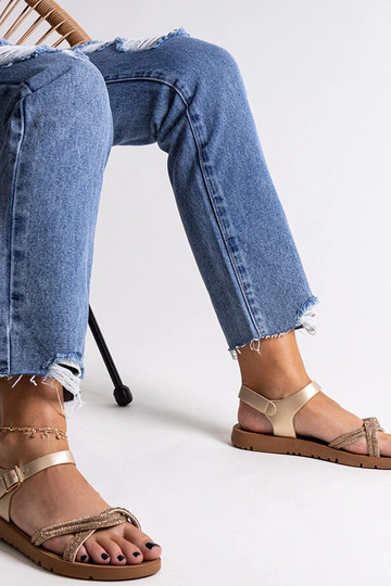 Guld sandaler dekoreret med... 2