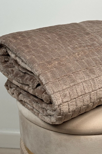 Beige gestikte deken