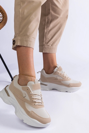 Beige sneakers med en... 2