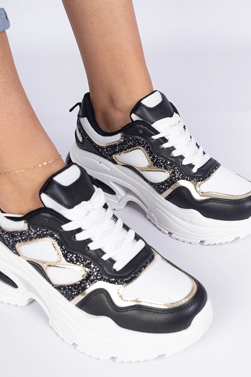 Zwarte dames sneakers versierd met... Zwarte dames sneakers versierd met...