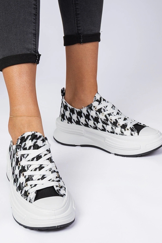 Wit-zwarte dames sneakers van stof... Wit-zwarte dames sneakers van stof...