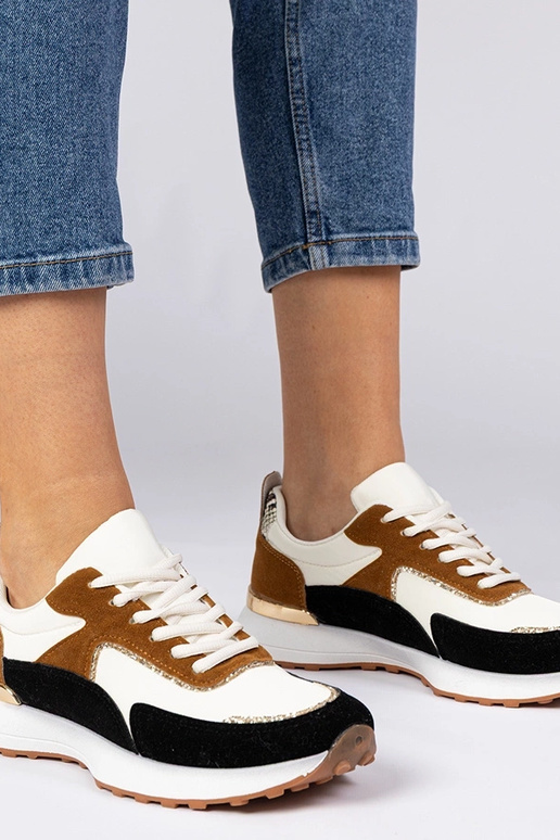 Wit-zwarte dames sneakers met... Wit-zwarte dames sneakers met...