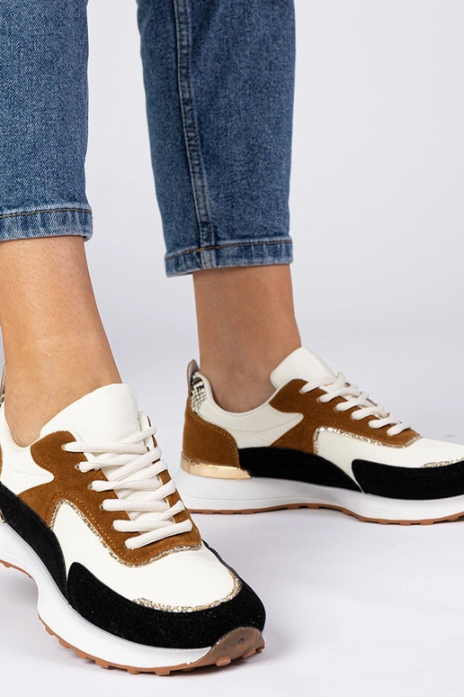 Wit-zwarte dames sneakers met... Wit-zwarte dames sneakers met...