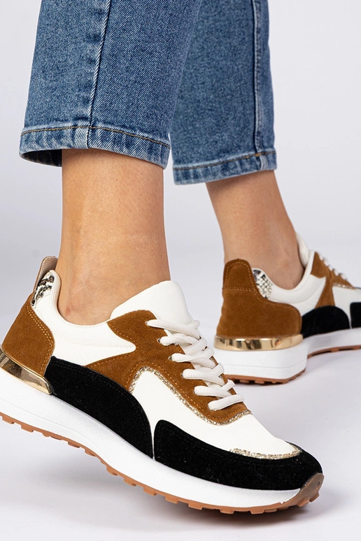 Wit-zwarte dames sneakers met... Wit-zwarte dames sneakers met...