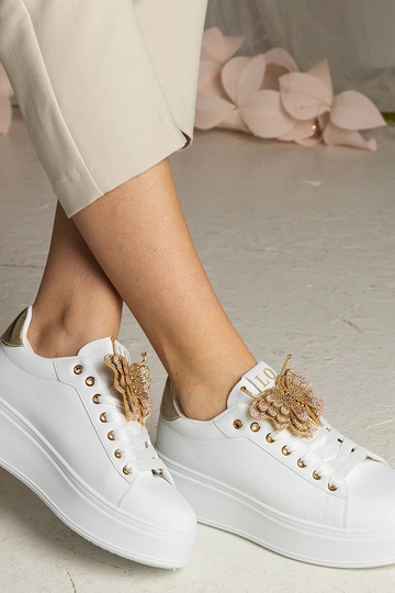 Wit-gouden sneakers met...
