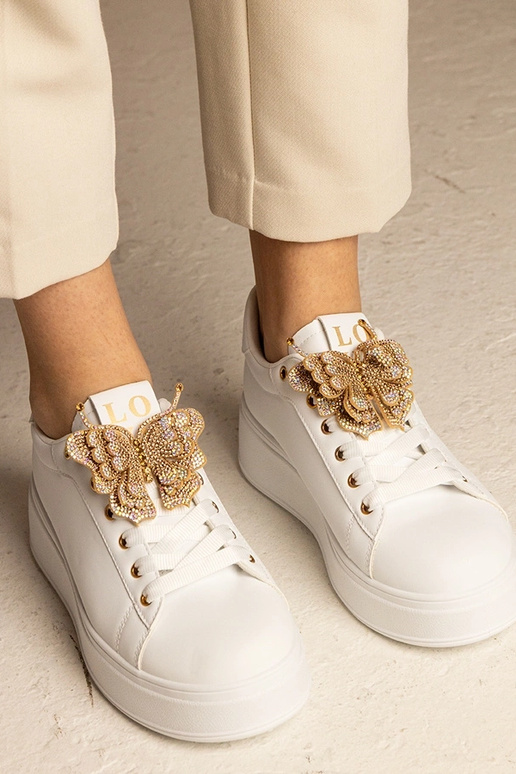 Witte sneakers met vlinder en... Witte sneakers met vlinder en...