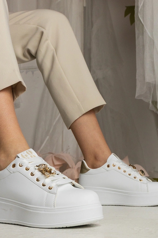 Zwart-gouden dames sneakers versierd...