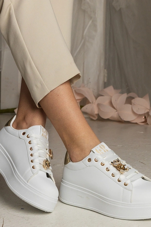 Zwart-gouden dames sneakers versierd...