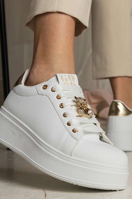 Zwart-gouden dames sneakers versierd...