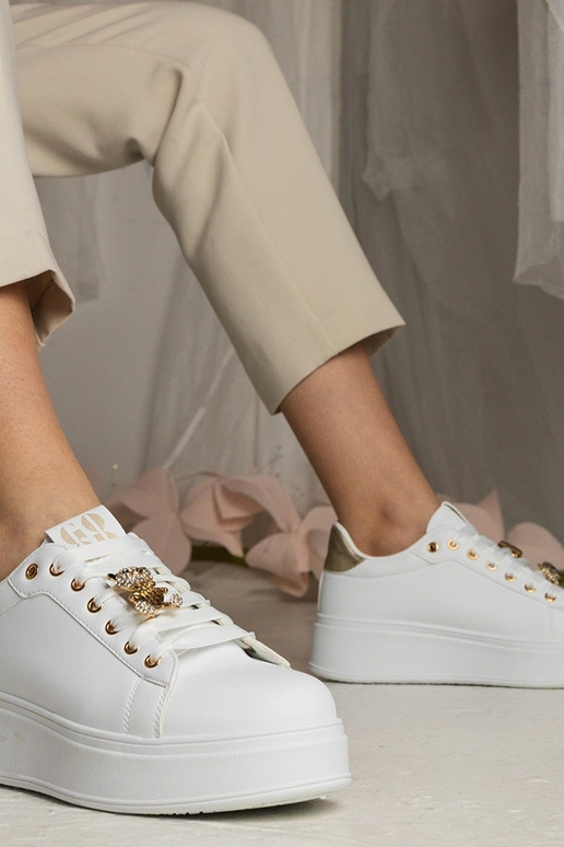 Zwart-gouden dames sneakers versierd...