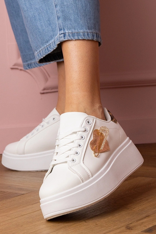 Witte dames sportschoenen met... Witte dames sportschoenen met...