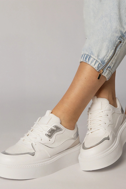 Witte sportschoenen met stoffen...