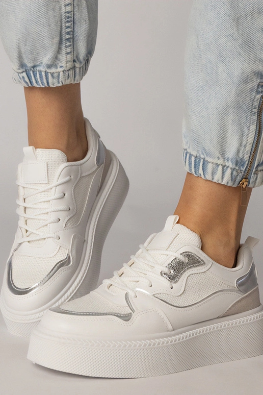 Witte sportschoenen met stoffen...