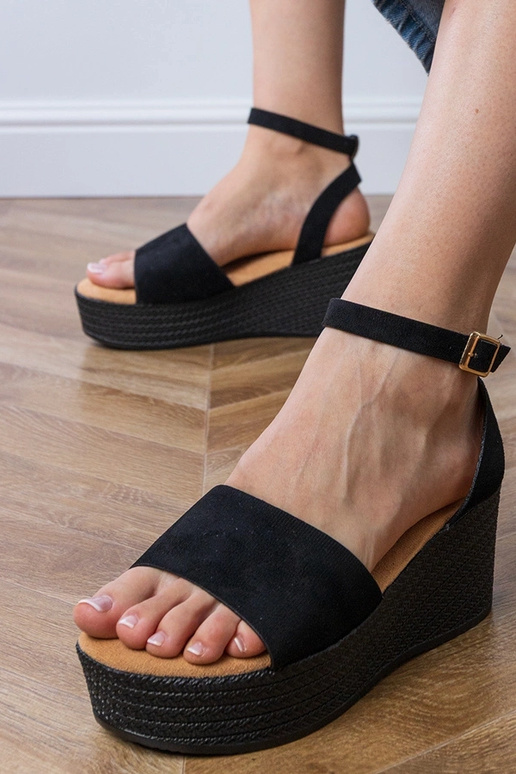 Zwarte sandalen op een platform van...