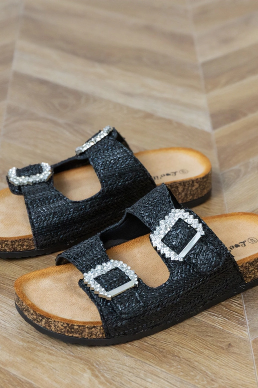 Zwarte slippers op kurken zool met... Zwarte slippers op kurken zool met...