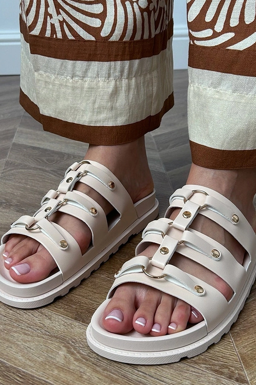 Zandkleurige Romeinse slippers met... Zandkleurige Romeinse slippers met...