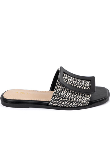 Zwart-witte platte slippers