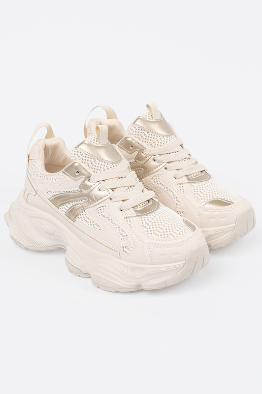 Ivory kleurige sportieve schoenen op...