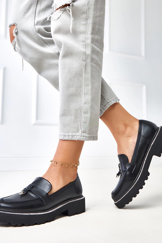 Zwarte mocassins met versiering en...