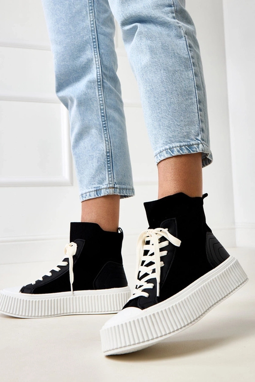 Zwarte instappers in sokkenstijl met... Zwarte instappers in sokkenstijl met...