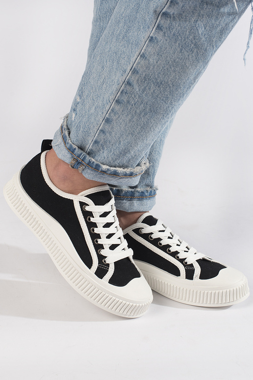 Zwarte dames sneakers met plateau in... Zwarte dames sneakers met plateau in...