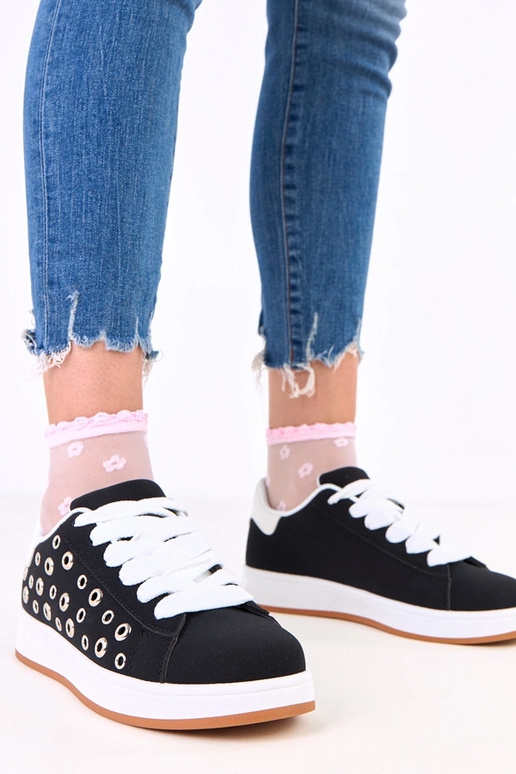 Zwarte sneakers op platform met studs...