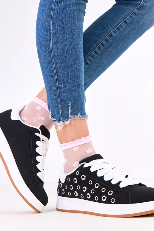 Zwarte sneakers op platform met studs...