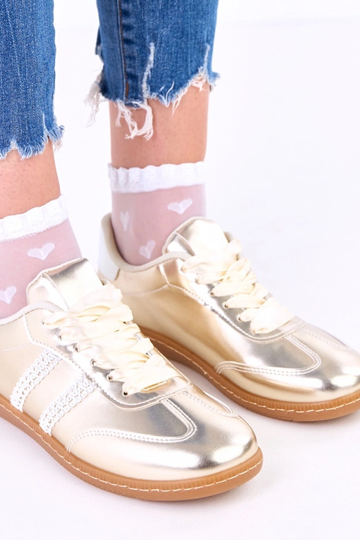 Gouden dames sneakers met satijnen...