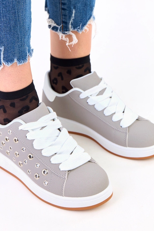 Grijze sportieve schoenen op plateau...