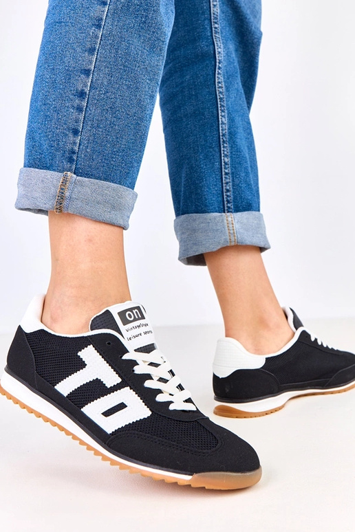 Zwarte sportschoenen met witte...