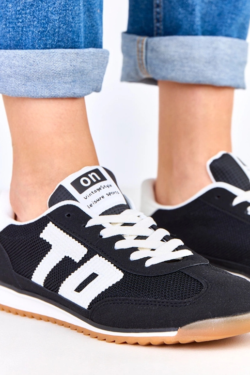 Zwarte sportschoenen met witte...