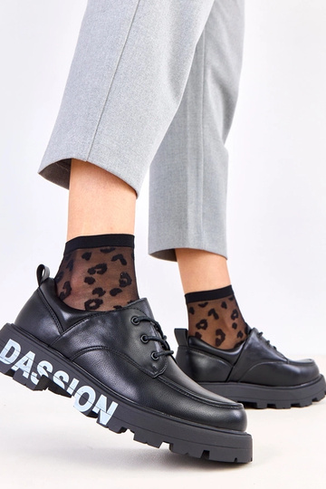 Zwarte dames halfhoge schoenen met patroon op de zool Klowis