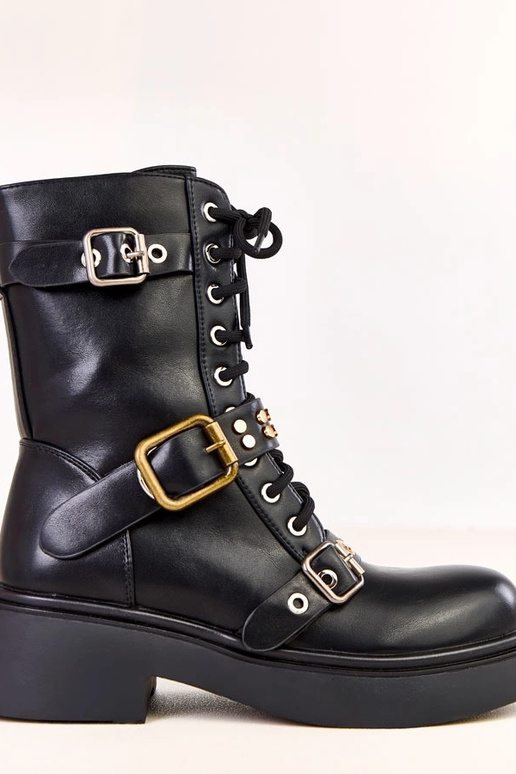 Zwarte dameslaarzen versierd met...