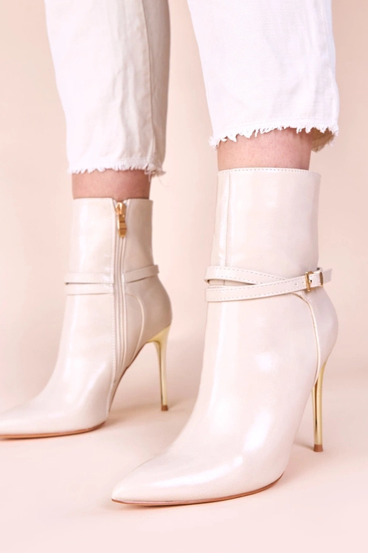 Beige enkellaarsjes op gouden hoge...