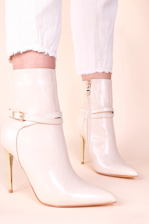 Beige enkellaarsjes op gouden hoge...