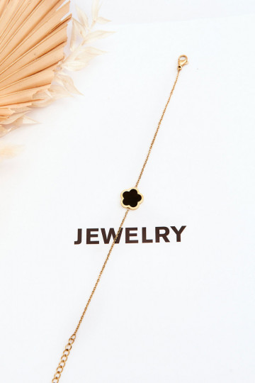Vrouwenarmband met een zwarte bloem in gouden kleur 2