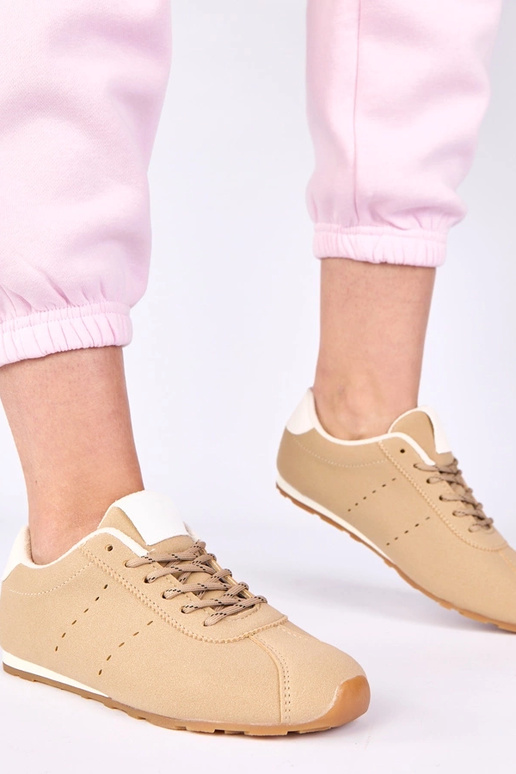 Zandkleurige sneakers met witte...