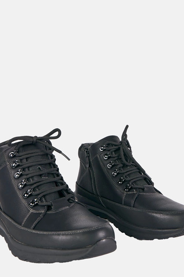 Zwarte heren sneakers, gevoerd met bont op een platform Paul