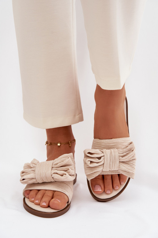 Dames slippers met brede hakken en strikken in zandkleur Amivelle